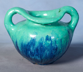 (Figure 1 - HF.11.32.01) A two-handled pot featuring blue and turquoise glaze commonly used in Doull's pottery practice.