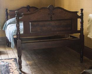 Double bed with matching carved head and footboards.