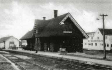 Old black and white photo showing outside of Kensington Station