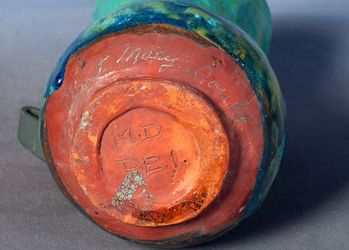 (Figure 5 - HF.12.08.07) View of a Doull vase base, signed "M.D. PEI" with "Aunt Mary Doull" written in pencil.